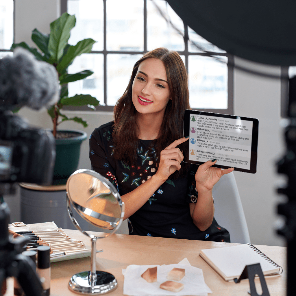 a woman showing something on a tab